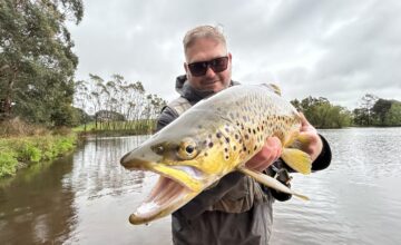 Man holding brown trout